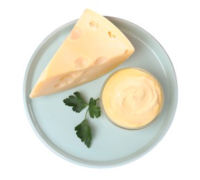 Tasty cheese, sauce and parsley on white background, top view