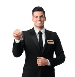 Happy receptionist in uniform holding key on white background