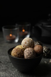 Photo of Delicious vegan candy balls on grey table, space for text