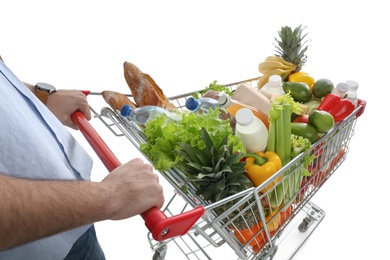 Man with shopping cart full of groceries on white background, closeup