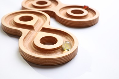 Photo of Labyrinth balance boards on white background, closeup. Montessori toy