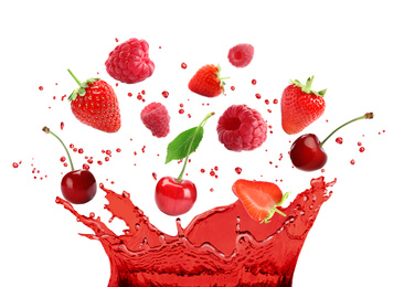Delicious ripe berries falling in juice with splashes on white background