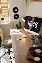 Room interior with comfortable workplace. Modern computer on wooden desk