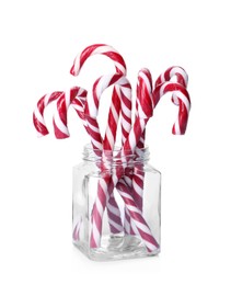 Sweet Christmas candy canes in glass jar on white background