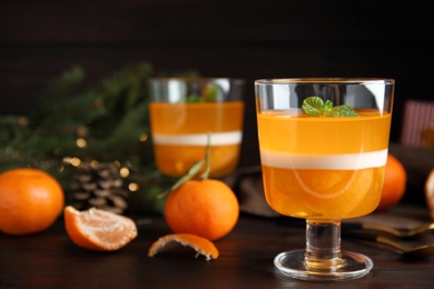 Delicious tangerine jelly on brown wooden table
