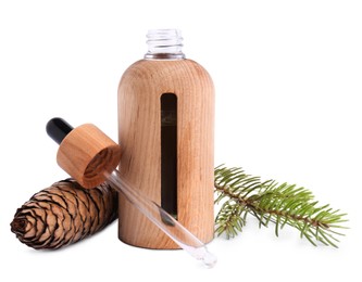 Bottle of pine essential oil and cone on white background