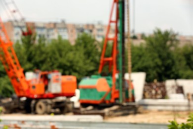 Blurred view of construction site with heavy machinery