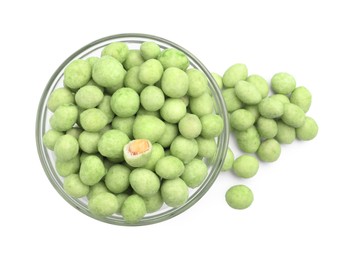 Tasty wasabi coated peanuts on white background, top view