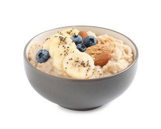 Tasty oatmeal porridge with different toppings in bowl on white background