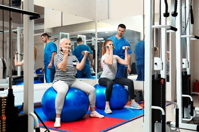 Patients exercising under physiotherapist supervision in rehabilitation center
