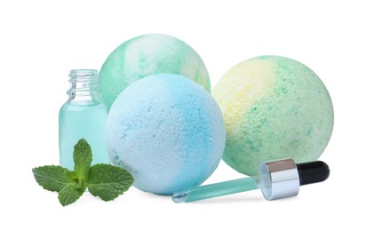 Fragrant bath bombs, oil and mint on white background