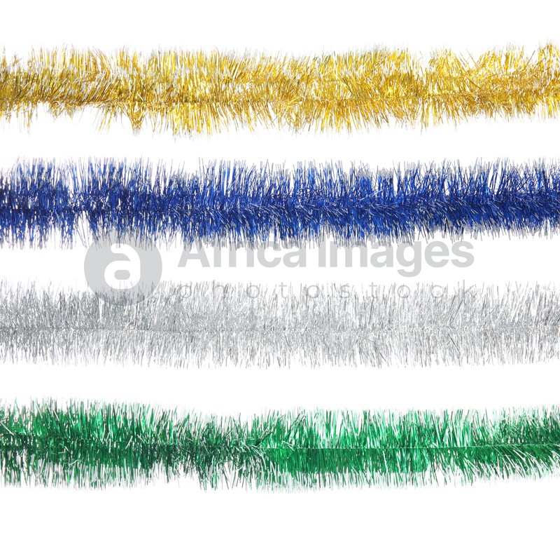 Set with different shiny tinsels on white background. Christmas decoration