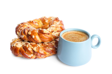 Delicious pastries and coffee on white background
