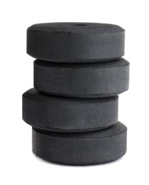 Stack of charcoal rings for hookah on white background