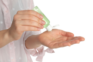 Woman applying sanitizer gel on white background, closeup