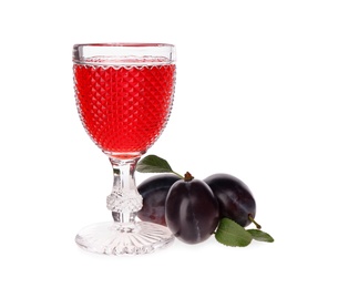 Delicious plum liquor and ripe fruits on white background. Homemade strong alcoholic beverage