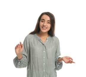 Young woman in casual clothes talking on white background