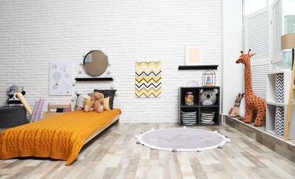 Montessori bedroom interior with floor bed and toys
