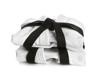 Martial arts uniform with black belts on white background