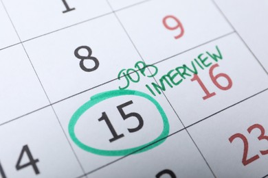 Photo of Calendar with date reminder about job interview, closeup