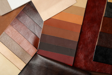 Different leather samples as background, flat lay