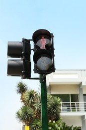 Traffic lights with red signal near building outdoors