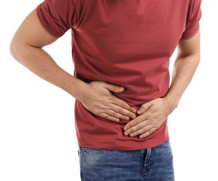 Man suffering from pain in lower right abdomen on white background, closeup. Acute appendicitis