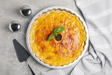 Delicious pie with minced meat on light grey table, flat lay