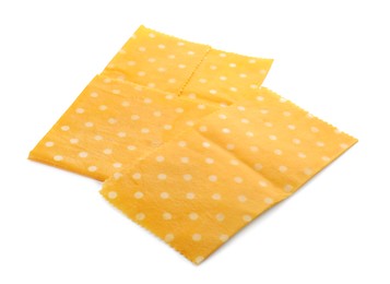 Yellow reusable beeswax food wraps on white background