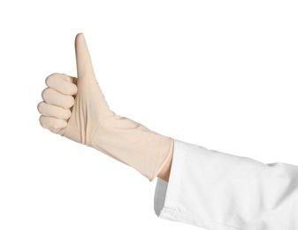 Doctor in medical glove showing thumb-up gesture on white background
