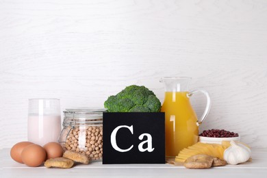 Food high in calcium. Different products on white wooden table