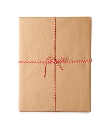 Gift box wrapped in kraft paper with bow isolated on white