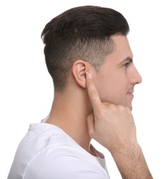 Man pointing at his ear on white background