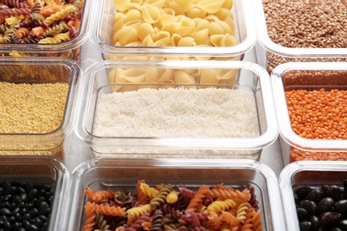 Photo of Many boxes with different raw food, closeup