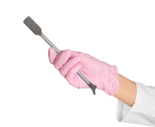 Doctor in sterile glove holding medical instrument on white background