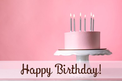 Happy Birthday! Delicious cake with burning candles on pink background