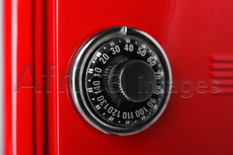 Red steel safe with mechanical combination lock, closeup