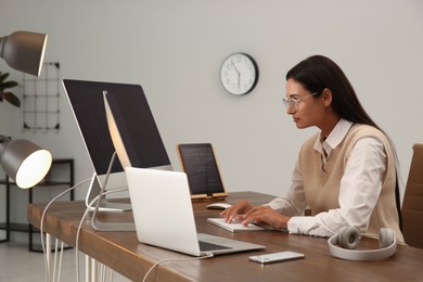 Programmer working at desk in modern office