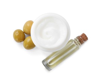Body cream and cosmetic product with olives on white background, top view