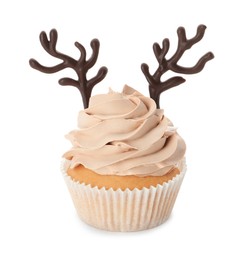 Delicious Christmas cupcake with chocolate reindeer antlers isolated on white