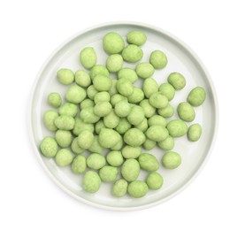 Plate with wasabi coated peanuts on white background, top view