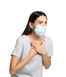 Young woman with protective mask suffering from breathing problem on white background