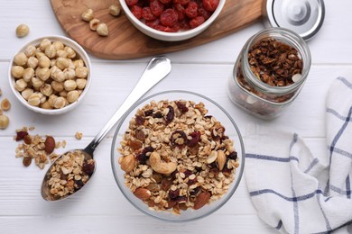 Flat lay composition with tasty granola on white wooden table