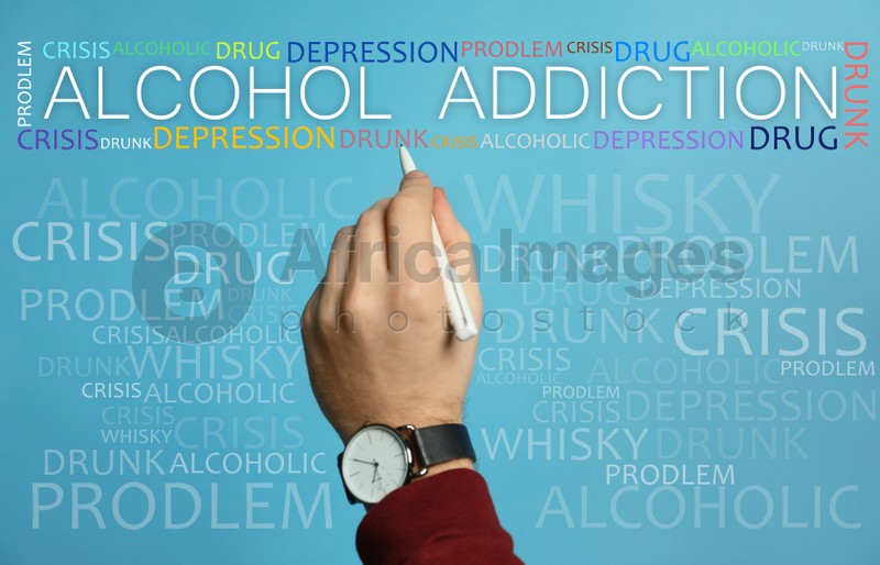 Alcohol addiction? - We can help you. Closeup view of man with pen against light blue background