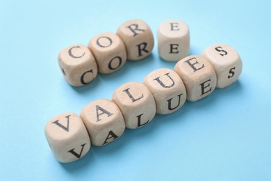 Photo of Beads with phrase CORE VALUES on light blue background