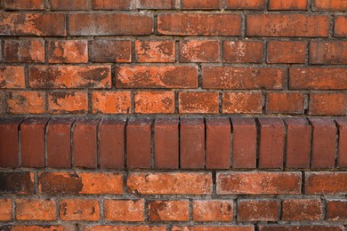 Texture of old red brick wall as background