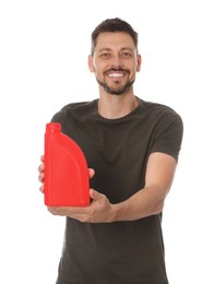 Man showing red container of motor oil on white background