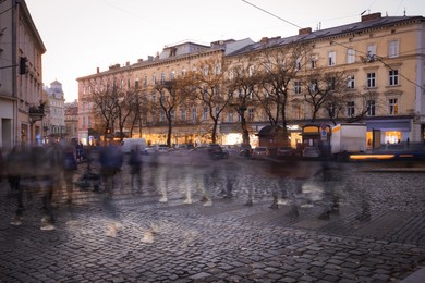 People crossing city street, long exposure effect