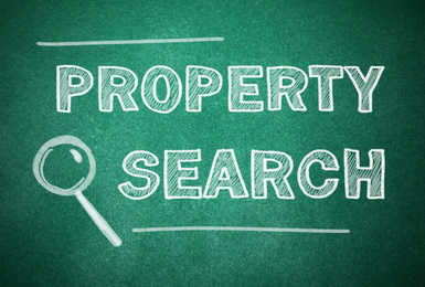 Text Property Search and magnifier illustration on green chalkboard