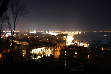 Photo of Panoramic view of modern night city. Bokeh effect